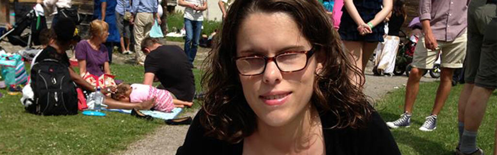 Alicia with glasses and long dark hair