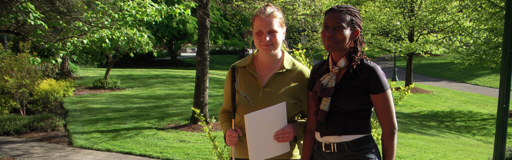 Two women with their white canesTwo Humphrey recipients, Svetlana and Brigette, with their white canes. .
