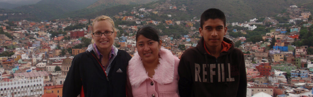 Mallory stands with two of the Deaf Mexican students she worked with.
