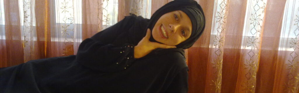 Carla Valpeoz in Arabic covering dress