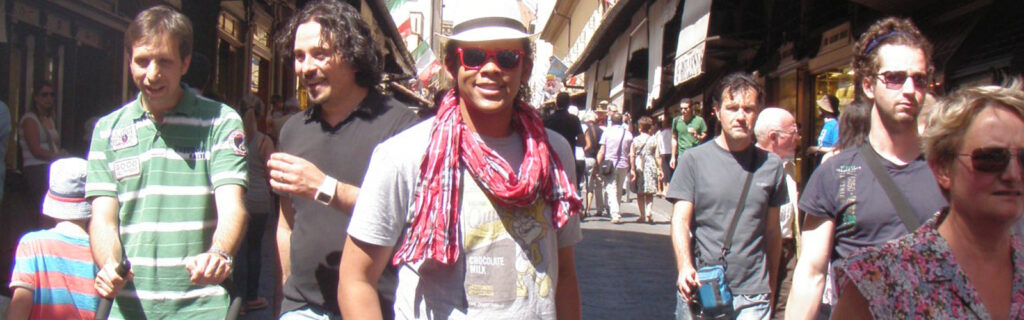 Perseus with a white hat and sunglasses on in the streets of Florence