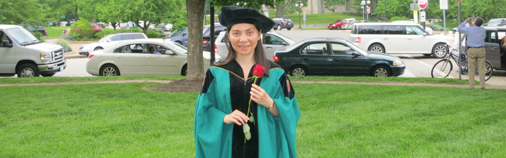 Luu Thi Anh Loan wearing a graduation cap and gown
