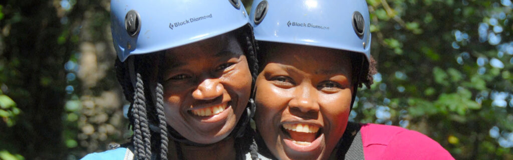 Lizzie Kiama (right) and a friend wear helemts and smile for a photo