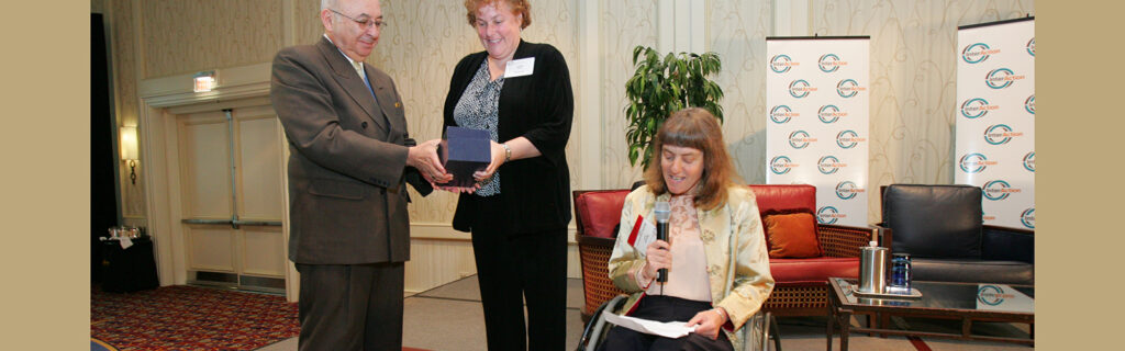 Susan Sygall publicly thanking two individuals