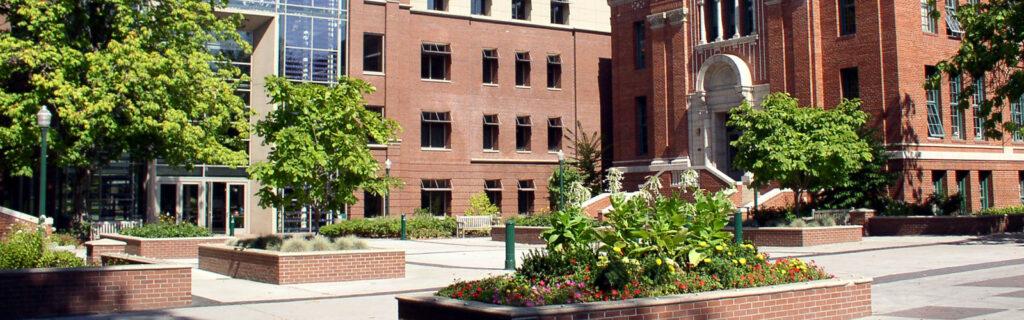 U.S. campus with brick buildings and trees.