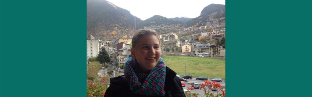 Erinn standing in front of mountains in Spain.