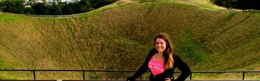 Elana with a green hillside behind
