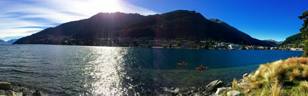 Island surrounded by clear blue body of water