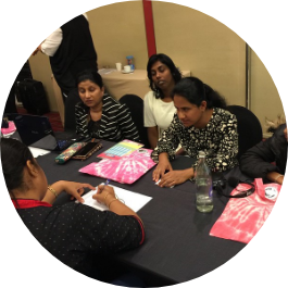 A small group discussion of women with disabilities around a table.