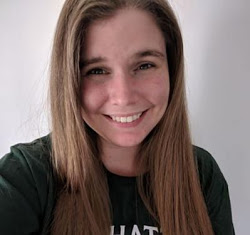 Portrait of Lindsey shoulders up, smiling at the camera.