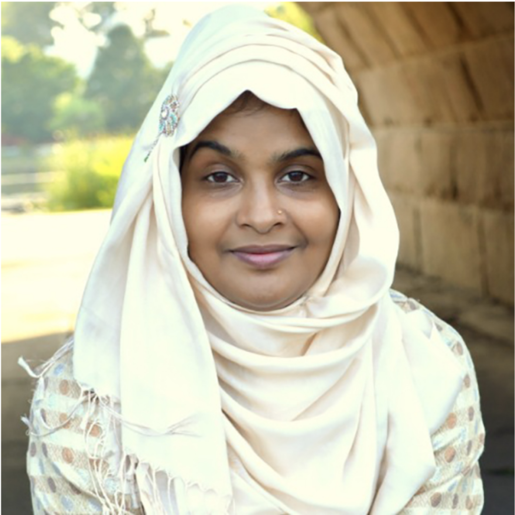 Portrait of Suraiya from shoulders up in out door setting.