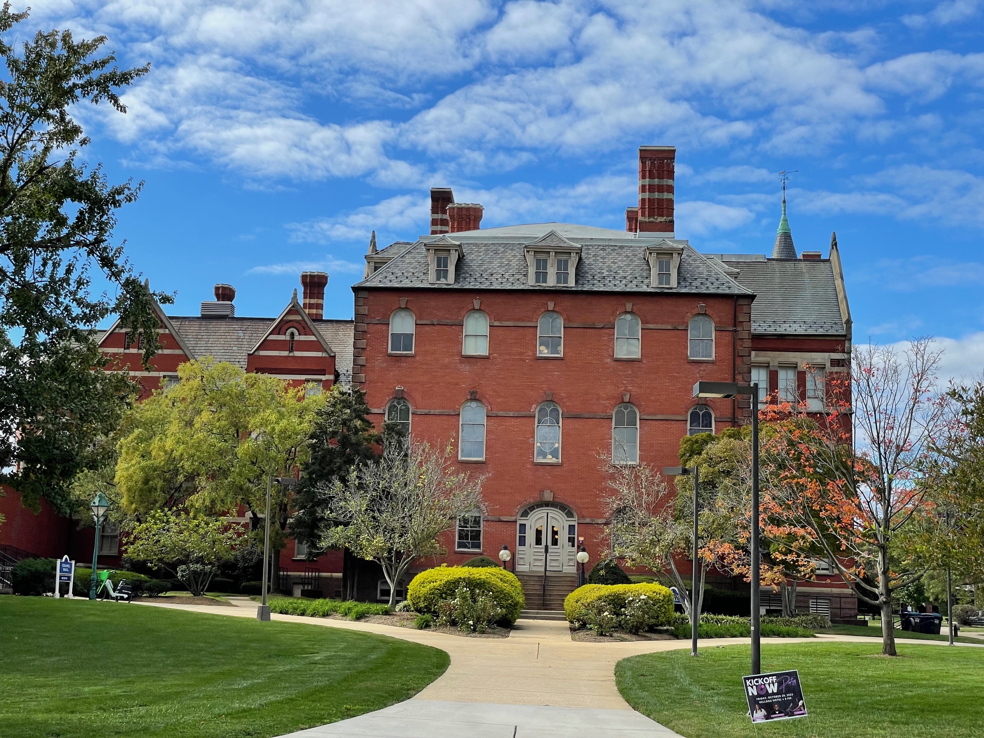 A brick building on the Gallaudet campus with path leading to it under bright blue sky