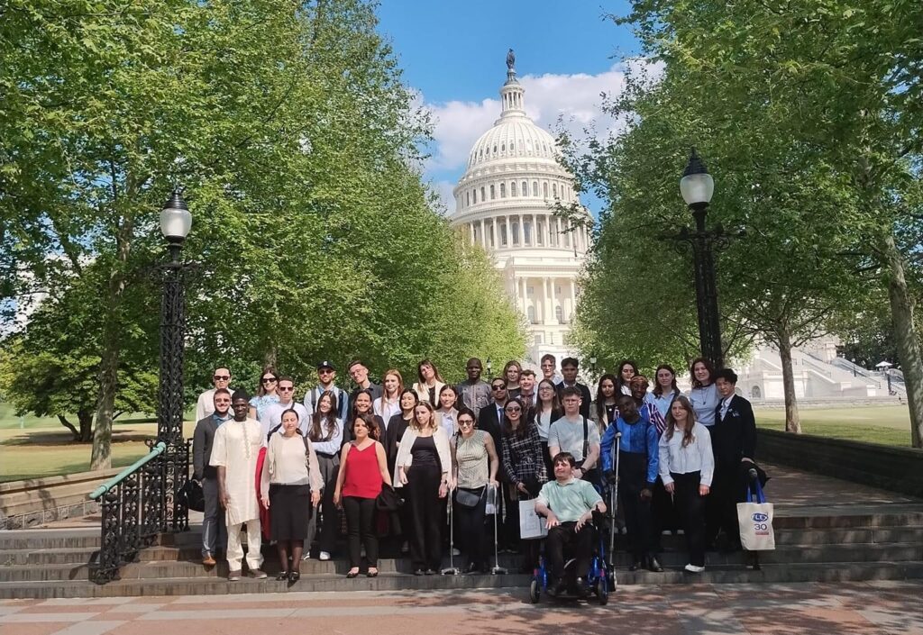 Group of alumni gather in front of the U.S. Capitol Building in Washington, DC.