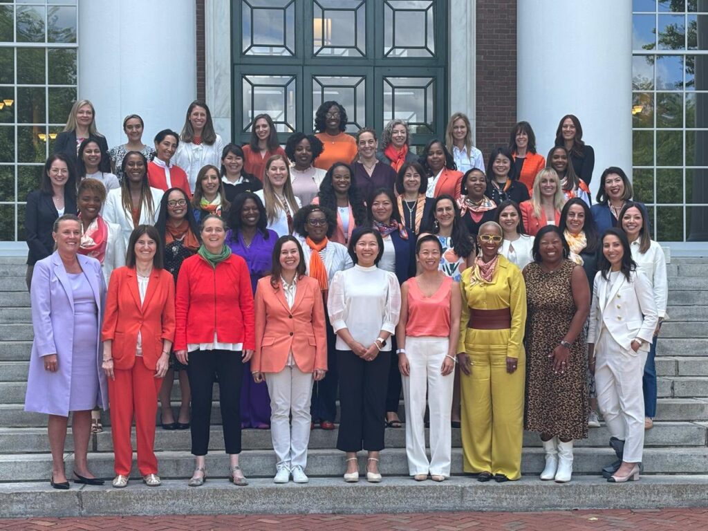 Karine standing towards front row far left in the large group of women from around the world