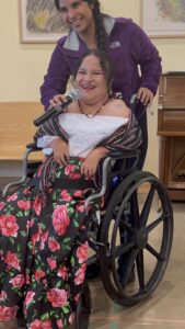 A WILD delegate from Mexico speaks into a microphone at the Community Celebration event.