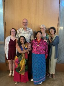 WILD Delegates from India and Bhutan smiling with their host family.