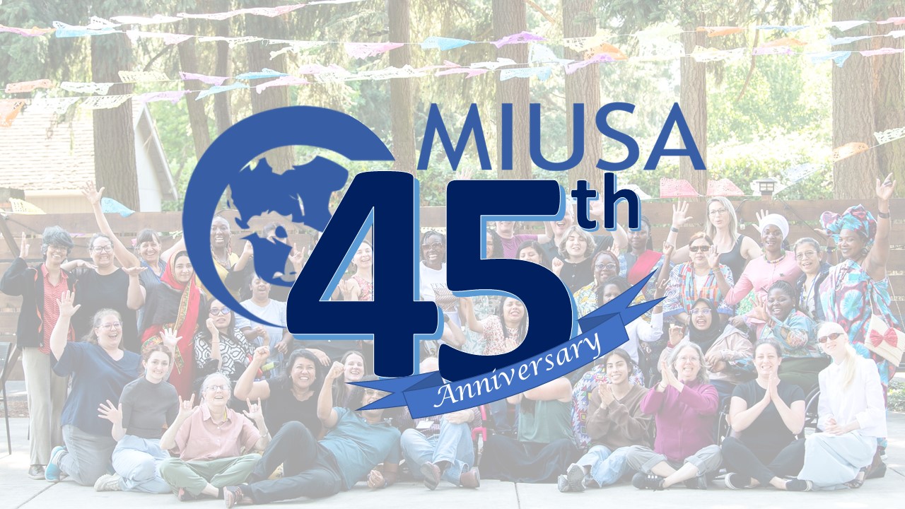 MIUSA 45th anniversary logo and blue ribbon with transparent photo in background of large group of cheering people